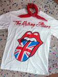 White Rolling Stones graphic tee featuring the iconic tongue and lips logo with a Union Jack flag design, paired with a red bandana—vintage rock band tee for women, perfect for casual or concert looks with retro UK flair.